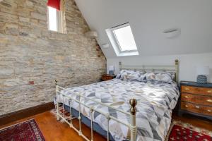 En eller flere senge i et værelse på The Barn @ Swanage Farm