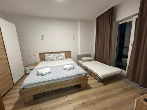 Postel nebo postele na pokoji v ubytování Markovi Apartments