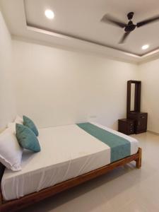 Rúm í herbergi á Saai Rooms +12 myndir