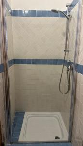 a shower stall with a tub in a bathroom at Schicciolina in Stromboli +16 photos