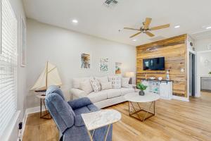 a living room with a couch and a tv at Oasis Retreat in Rockport