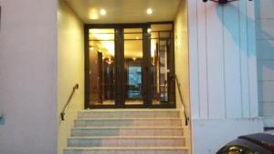 a staircase leading to a building with a glass door at Chambre Privée 1 BONNEUIL SUR MARNE 30 minutes from Paris in Bonneuil-sur-Marne