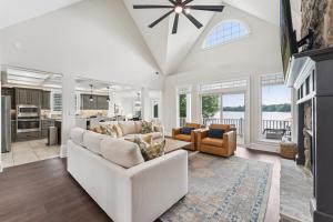 a living room with a white couch and a table at Still Waters at Bankhead in Denver
