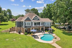 an aerial view of a house with a swimming pool at Still Waters at Bankhead in Denver