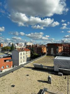 a view of a city from the roof of a building at Studio cosy avec vidéoprojecteur, à 100m du métro in Saint-Ouen