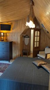 a bedroom with a large bed in a room at Namelis prie Magnolijos in Druskininkai