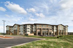 an exterior view of a apartment building at ClubHouse Hotel & Suites Rapid City in Rapid City