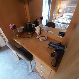 a wooden desk with a camera on top of it at Forest view in Ballycassidy