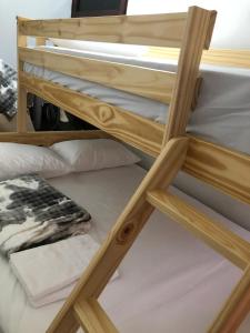 a group of bunk beds in a room at Apartamentos contiguos cerca a Parque de Bello Antioquia in Bello