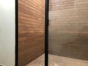 a wooden wall with a door in a room at Apartamentos contiguos cerca a Parque de Bello Antioquia in Bello +47 photos