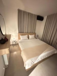 Ένα ή περισσότερα κρεβάτια σε δωμάτιο στο Mini villa