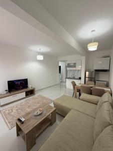 a living room with a couch and a table at FB Apartments in Ulcinj