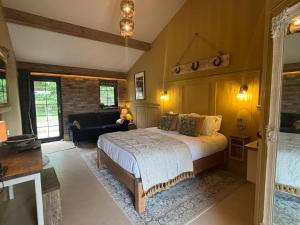 a bedroom with a bed and a living room at Accommodation Bristol Airport in Redhill