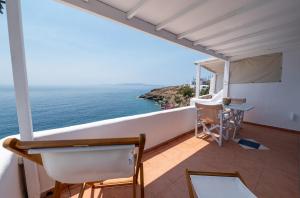 a balcony with a view of the ocean at Kardiani Blue Serenity in Kardhianí