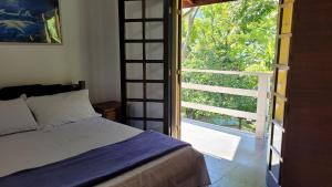 Postel nebo postele na pokoji v ubytování Casa Aconchegante na Praia de Paúba