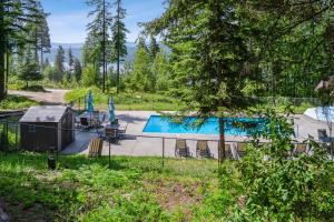 an image of a swimming pool in a yard at Cedar Creek Cabin in Whitefish