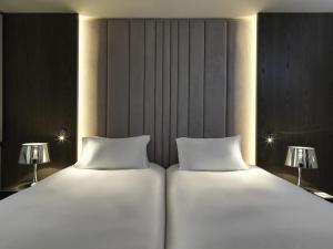 Postel nebo postele na pokoji v ubytování Sofitel Athens Airport