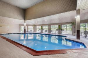 a large swimming pool in a large building at Best Western West Greenwich Inn in West Greenwich
