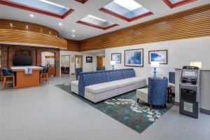 a living room with a couch and a table at Best Western West Greenwich Inn in West Greenwich