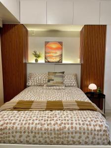 En eller flere senge i et værelse på Taft East Gate Condominium - Cebu City