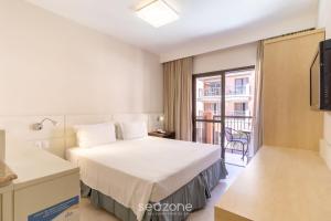 Resort pé na areia - Suítes JBVTOP客房内的一张或多张床位