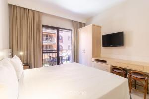 Resort pé na areia - Suítes JBVTOP的电视和/或娱乐中心