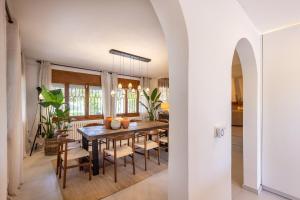 a dining room with a table and chairs at Villa Carmen - Peaceful Eco-Luxury with private pool in Cunit