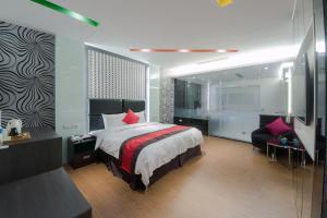 Voodi või voodid majutusasutuse Garden Spring Hotel toas