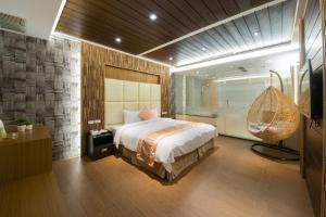 Voodi või voodid majutusasutuse Garden Spring Hotel toas