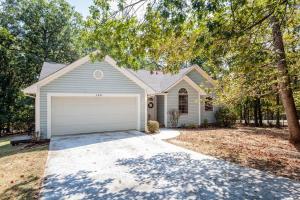 a house with a garage in a yard at Bear Cabin-3 BR 2 Bath with Indoor Hot tub-one level-Pool Pass-Pet welcome in McGaheysville