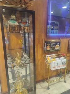 a glass display case with various items in it at Middle East Hotel Dubai in Dubai +20 photos