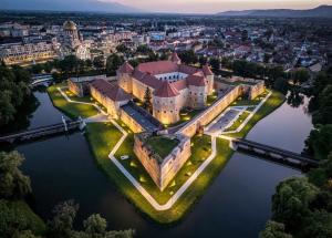 an aerial view of a castle on the water at Luxury Apartment in Făgăraş