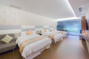 Voodi või voodid majutusasutuse Garden Spring Hotel toas