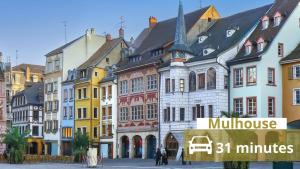 a group of buildings on a city street at Escapade saint louis Basel in Saint-Louis