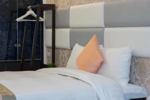 Voodi või voodid majutusasutuse Garden Spring Hotel toas