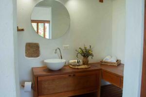 a bathroom with a sink and a mirror at Trinitarios in Barichara +37 photos