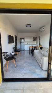 a living room with a couch and a table at MONACO Departamento PB in Federación