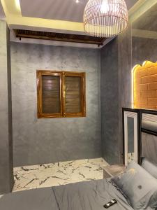 a bedroom with a bed and a window at Keur lumières in Dakar