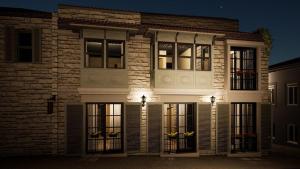 a brick building with lights in front of it at Submarin in Alaçatı