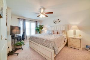 a bedroom with a bed and a ceiling fan at Beautiful PCB Getaway Less Than 3 Mi to the Beach! in Panama City Beach +18 photos