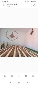 a room with a heart decoration on the wall at Gloria's HOME ISLA Amantaní in Puno
