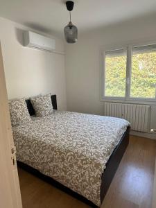Ένα ή περισσότερα κρεβάτια σε δωμάτιο στο Maison NADIA +16 φωτογραφίες