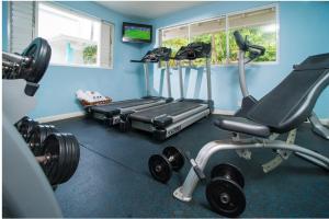 a gym with a treadmill and a exercise bike at Deja Resort All Inclusive in Montego Bay