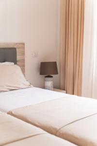 a bedroom with two beds and a lamp at Sunset view, Los Cristianos - Port Royale in Los Cristianos