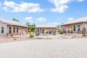 a row of houses with benches in front of them at RusTx Ranch Unit 7- Music in Wimberley