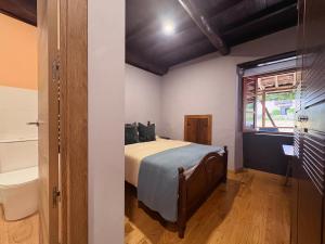 Ένα ή περισσότερα κρεβάτια σε δωμάτιο στο Casa-Museo Genia Trigo