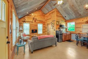 a living room with a couch and a kitchen at RusTx Ranch Unit 7- Music in Wimberley