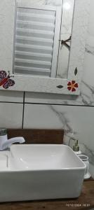 Et badeværelse på Estúdio Casa do Tamarineiro