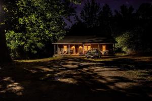 a house with a car parked in front of it at Stranger Things - Byers Home - 15 Min to ATL in Fayetteville
