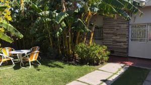 a table and chairs in the yard of a house at Refugio Andino in San Juan